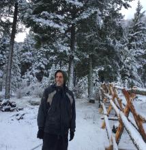 Ramanath beside fence